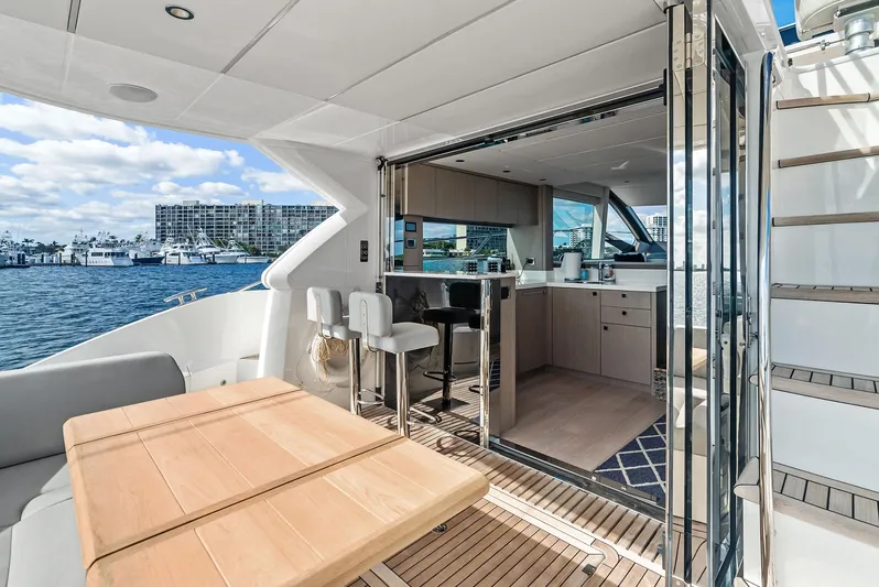 Almost Heaven Yacht Photos Pics Luxurious 2021 Sunseeker Manhattan 52 yacht interior with open deck and modern kitchen.