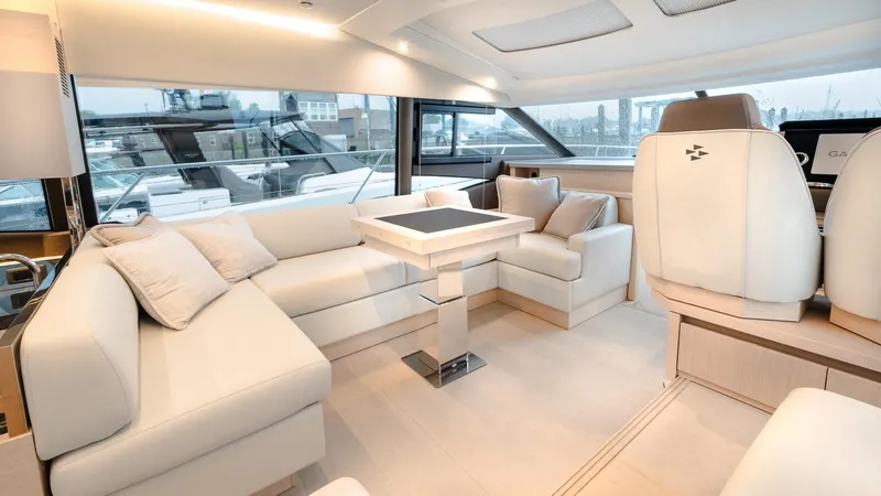 In Stock Yacht Photos Pics Luxurious interior of 2023 Prestige 520S yacht with elegant seating and modern design.