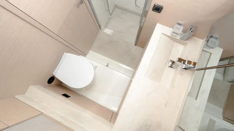 In Stock Yacht Photos Pics Modern bathroom in 2023 Prestige 520S yacht, featuring sleek fixtures and minimalist design.