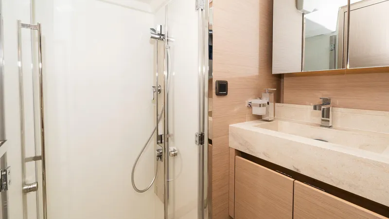 In Stock Yacht Photos Pics Modern bathroom in 2023 Prestige 520S yacht with sleek shower and elegant vanity.