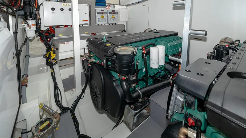 In Stock Yacht Photos Pics Engine room of 2023 Prestige 520S yacht, showcasing advanced machinery and components.