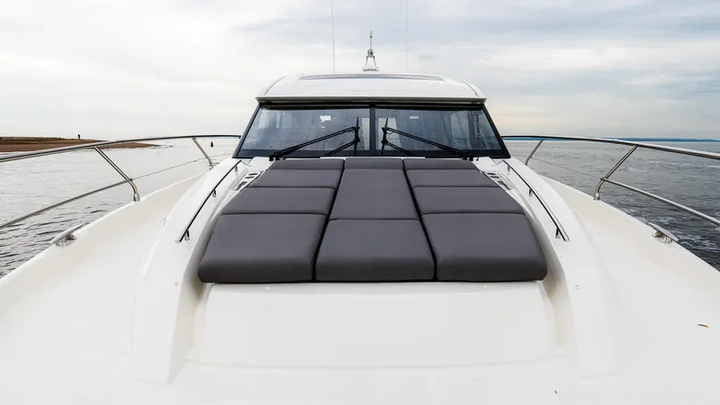 In Stock Yacht Photos Pics 2023 Prestige 520S yacht with sleek design and spacious sunbathing area.