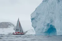 Sailboat "Tasman 48" near iceberg in icy waters, 1999.