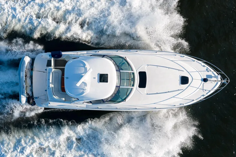  Yacht Photos Pics Top view of a 2004 Sea Ray 390 Sundancer yacht cruising on water.