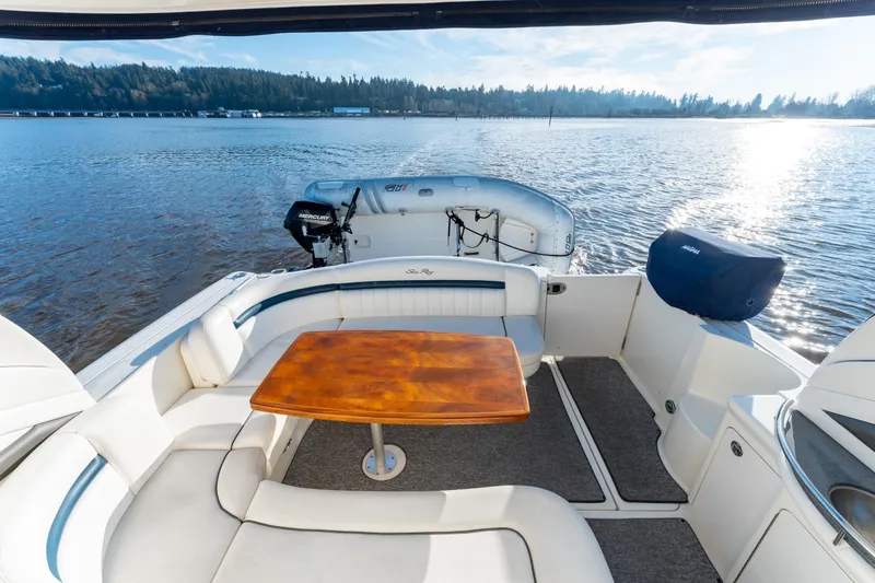  Yacht Photos Pics 2004 Sea Ray 390 Sundancer yacht with elegant seating and table on a sunny day.