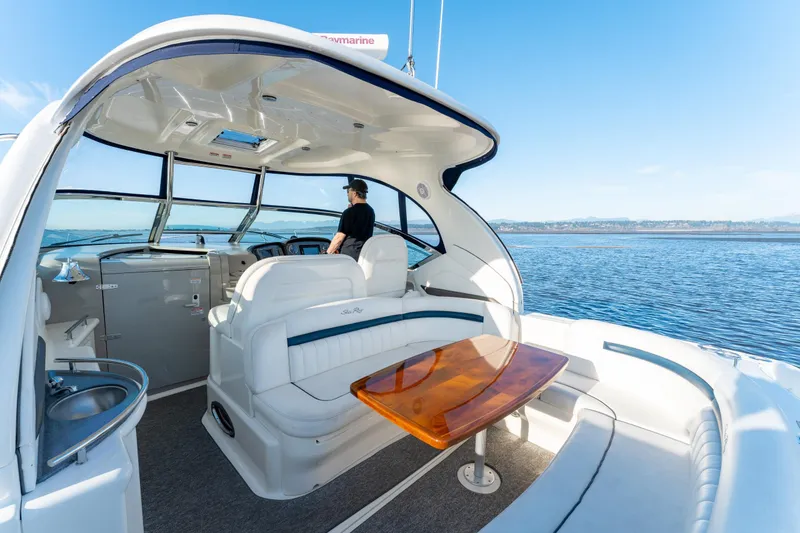  Yacht Photos Pics 2004 Sea Ray 390 Sundancer yacht interior with helm, seating, and ocean view.