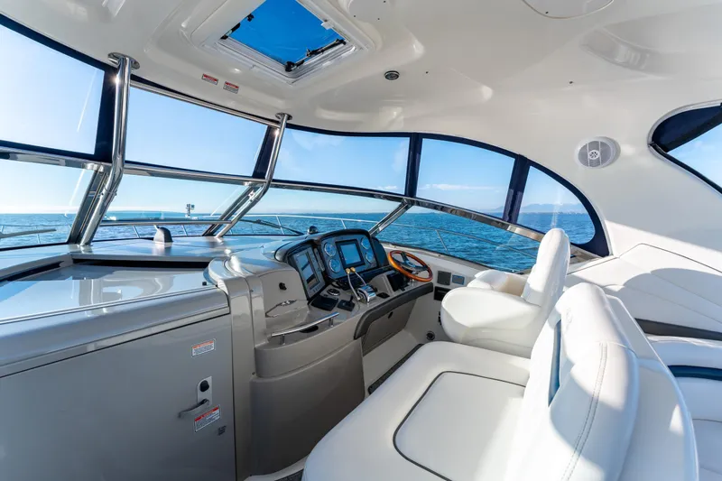  Yacht Photos Pics 2004 Sea Ray 390 Sundancer helm with panoramic ocean view and luxurious seating.