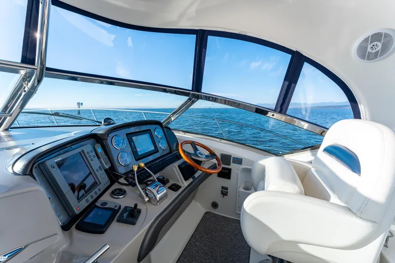  Yacht Photos Pics Helm of 2004 Sea Ray 390 Sundancer yacht with ocean view and modern controls.
