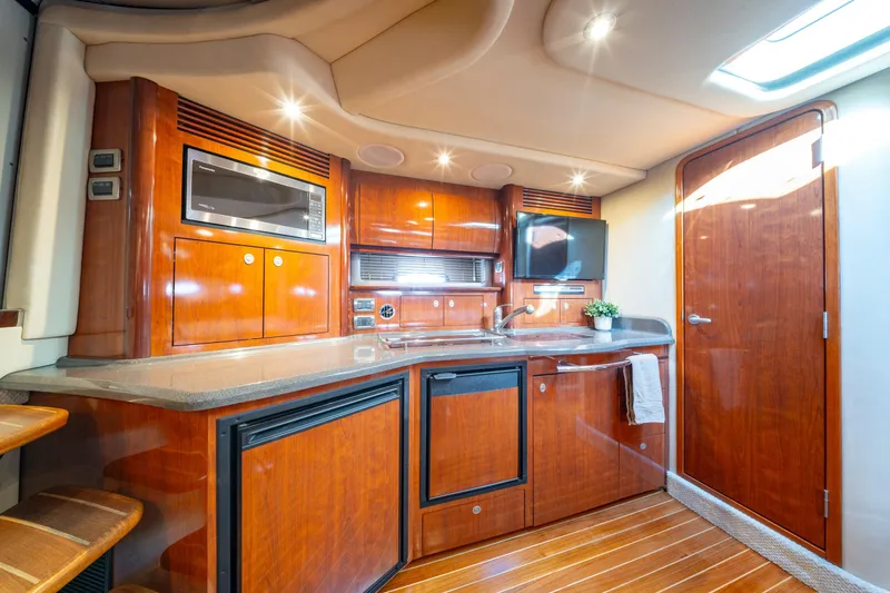  Yacht Photos Pics Luxurious 2004 Sea Ray 390 Sundancer yacht interior with modern kitchen amenities.