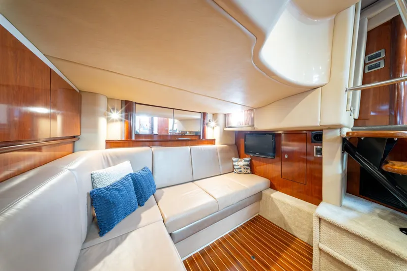  Yacht Photos Pics Luxurious interior of 2004 Sea Ray 390 Sundancer yacht with plush seating and wood accents.