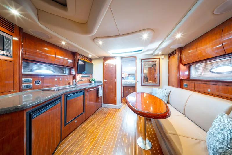  Yacht Photos Pics Luxurious interior of 2004 Sea Ray 390 Sundancer yacht with elegant wood finishes.