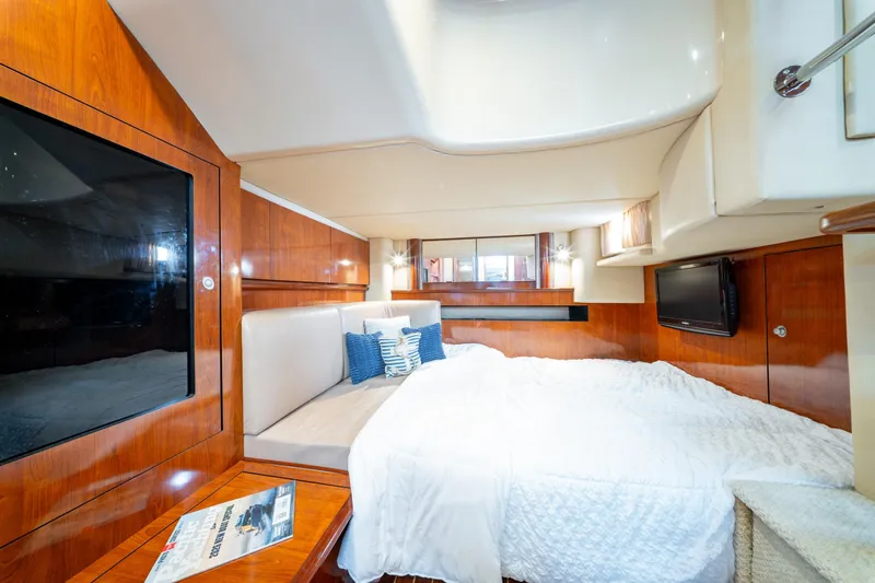  Yacht Photos Pics Luxurious cabin interior of 2004 Sea Ray 390 Sundancer yacht with cozy bedding.