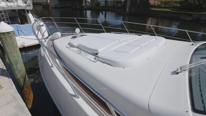  Yacht Photos Pics 2008 Azimut 62S yacht with sunbathing area docked at marina.