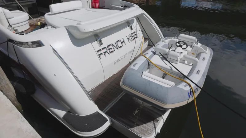  Yacht Photos Pics 2008 Azimut 62S yacht with a small inflatable boat docked.