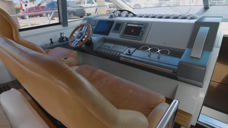  Yacht Photos Pics Helm station of 2008 Azimut 62S yacht with leather captain's chair and advanced navigation systems.
