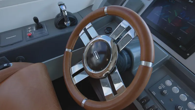  Yacht Photos Pics Steering wheel and controls of a 2008 Azimut 62S yacht.