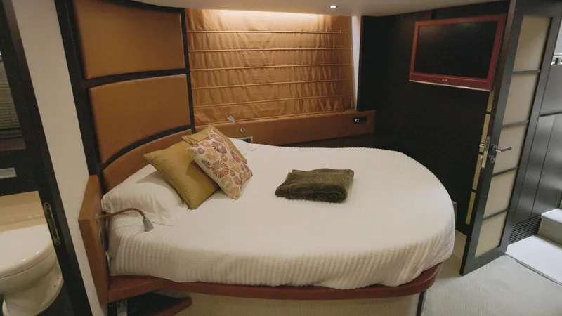  Yacht Photos Pics Luxurious bedroom in a 2008 Azimut 62S yacht with modern decor.