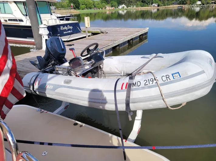 The Dark Side Yacht Photos Pics Inflatable dinghy docked beside a 2014 Sabre 48 Salon Express yacht.
