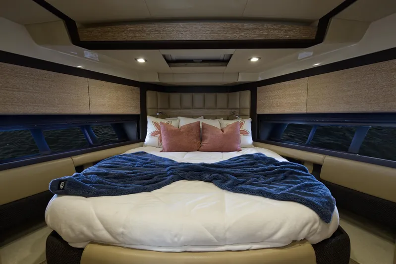 Neena Yacht Photos Pics Luxurious bedroom in 2015 Azimut 64 Flybridge yacht with cozy bedding and modern design.