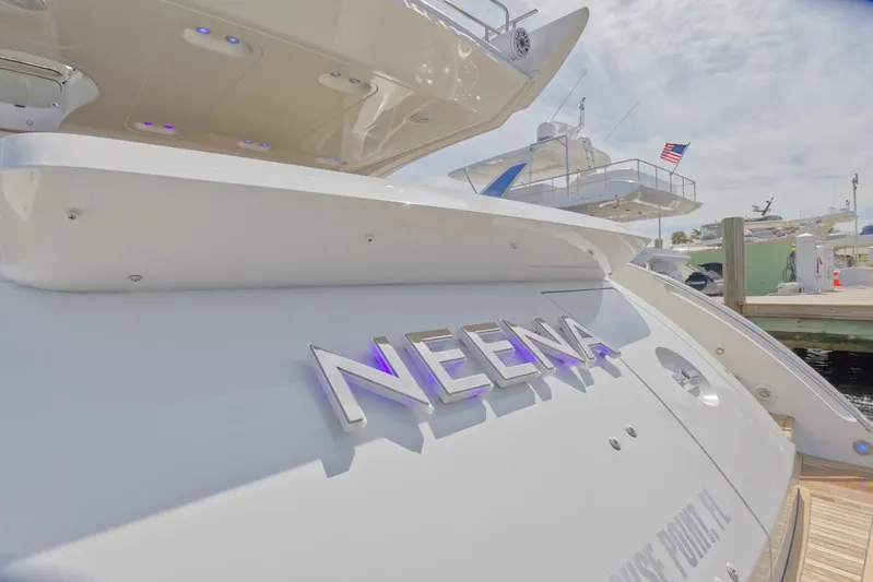 Neena Yacht Photos Pics 2015 Azimut 64 Flybridge yacht docked, rear view with NEENA nameplate.