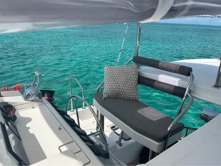  Yacht Photos Pics Leopard 40 yacht deck with seating, overlooking clear turquoise waters, 2018 model.