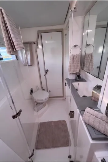  Yacht Photos Pics Modern bathroom in a 2018 Leopard 40 yacht with sleek fixtures and neutral decor.