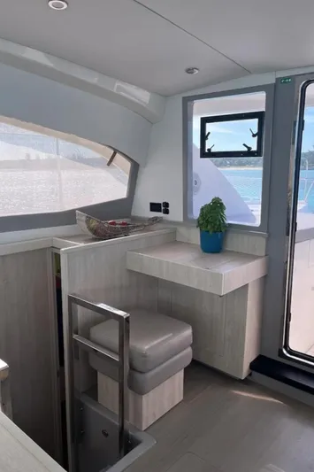  Yacht Photos Pics Interior of 2018 Leopard 40 catamaran with modern seating and window view.