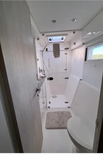  Yacht Photos Pics Modern bathroom interior in a 2018 Leopard 40 yacht, featuring sleek design and natural light.