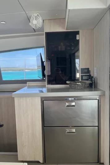  Yacht Photos Pics Modern kitchen area in a 2018 Leopard 40 yacht with stainless steel appliances.