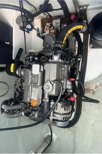  Yacht Photos Pics Engine compartment of a 2018 Leopard 40 catamaran, showcasing mechanical components and wiring.