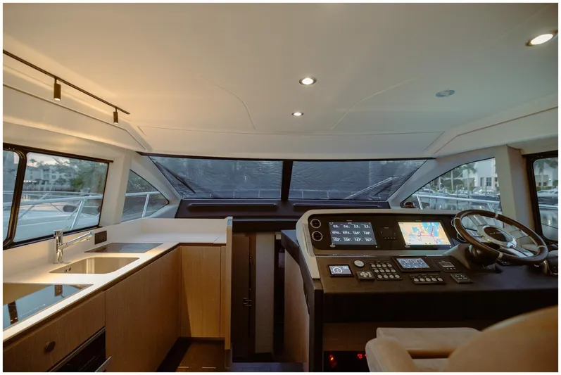  Yacht Photos Pics Interior of 2022 Azimut Fly yacht, featuring modern helm and sleek kitchen area.