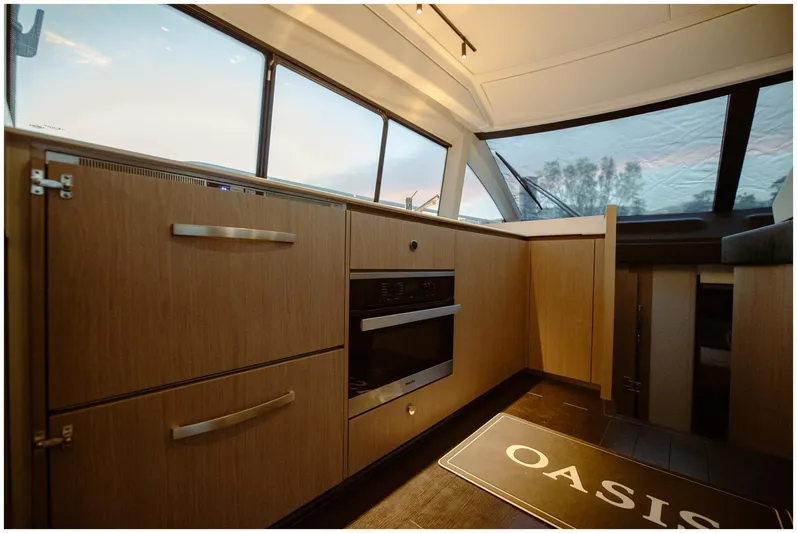  Yacht Photos Pics Interior of 2022 Azimut Fly yacht with modern kitchen and panoramic windows.