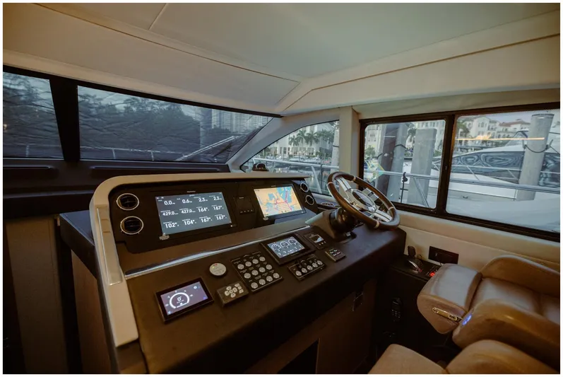  Yacht Photos Pics Luxurious Azimut 2022 Fly yacht cockpit with advanced navigation controls and plush seating.