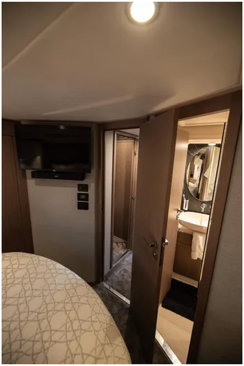  Yacht Photos Pics Interior of 2022 Azimut Fly yacht with TV and bathroom.