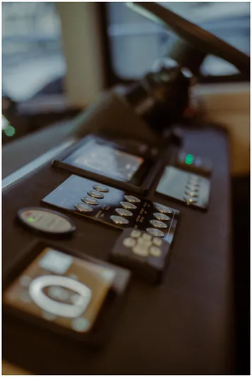  Yacht Photos Pics Control panel of a 2022 Azimut Fly yacht, featuring modern navigation instruments.