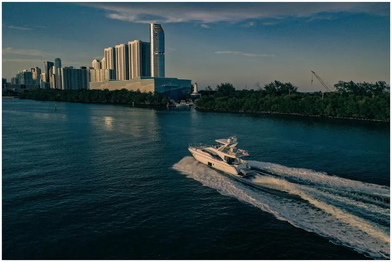  Yacht Photos Pics Azimut 50 Fly yacht cruising near city skyline, 2022 model.