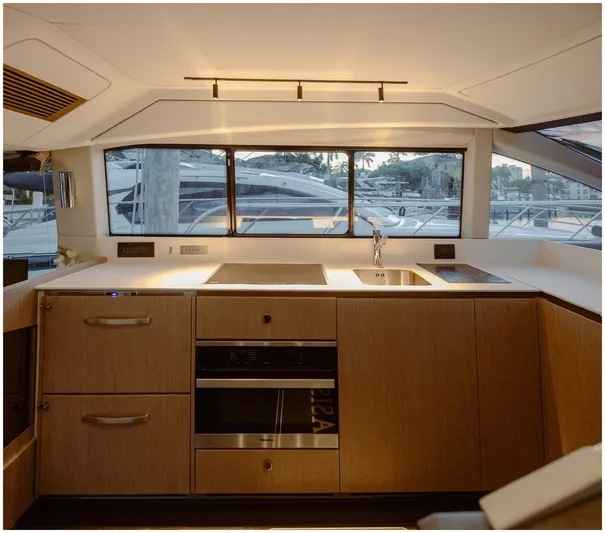  Yacht Photos Pics Modern kitchen interior of 2022 Azimut Fly yacht with sleek design and appliances.
