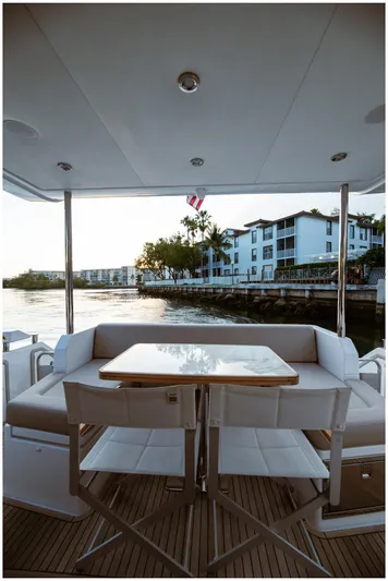 Yacht Photos Pics Luxury Azimut 2022 Fly yacht deck with elegant seating and waterfront view.
