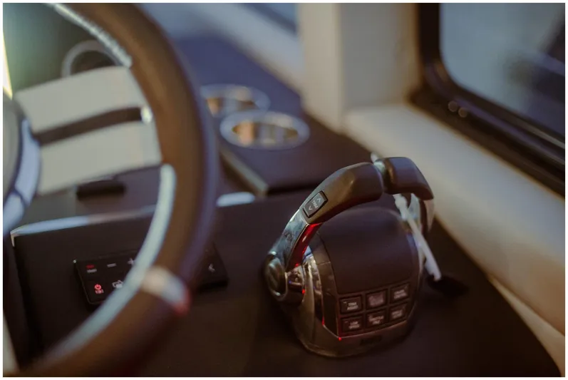  Yacht Photos Pics Control panel of a 2022 Azimut Fly yacht, featuring modern steering and throttle controls.