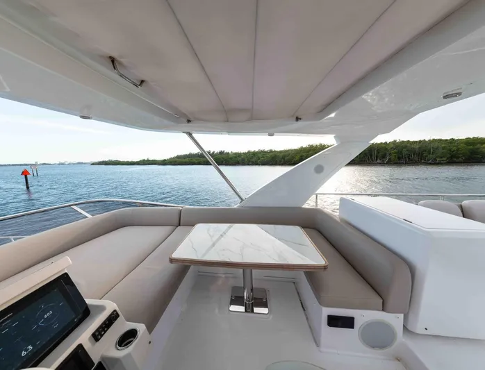  Yacht Photos Pics Luxurious seating area on 2022 Azimut 50 Fly yacht with scenic water view.