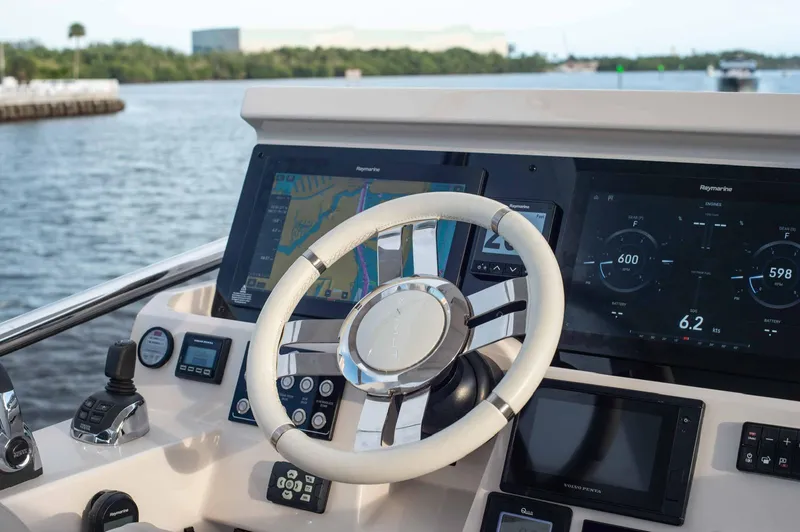  Yacht Photos Pics Cockpit of 2022 Azimut 50 Fly yacht with modern navigation displays and steering wheel.