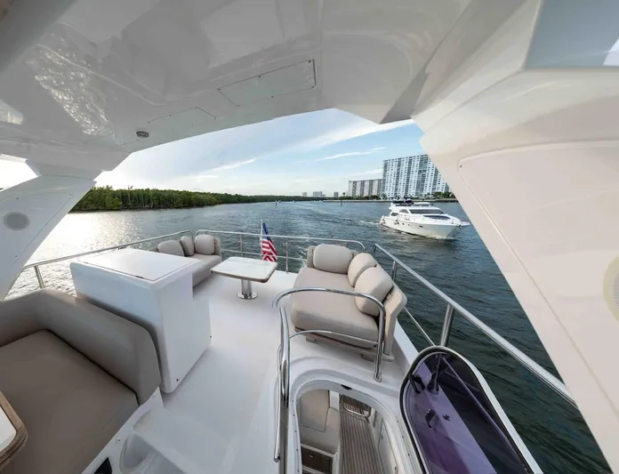  Yacht Photos Pics Luxurious 2022 Azimut 50 Fly yacht with spacious deck and scenic waterfront view.