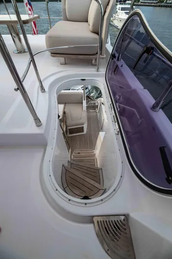  Yacht Photos Pics 2022 Azimut 50 Fly yacht interior with elegant seating and wooden flooring.