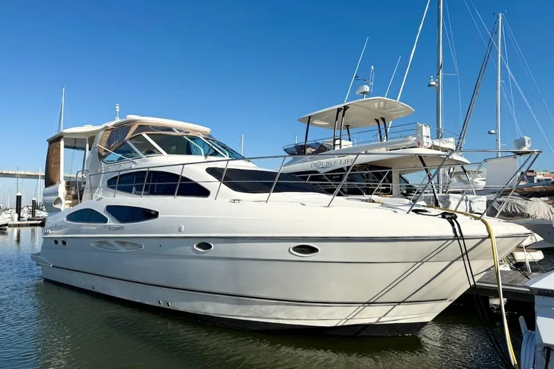 No Worries Yacht Photos Pics 2006 Cruisers Yachts 415 Express Motoryacht docked in marina under clear blue sky.