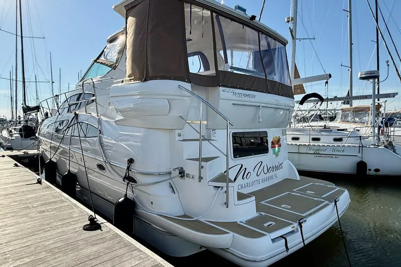 No Worries Yacht Photos Pics 2006 Cruisers Yachts 415 Express Motoryacht docked at marina, rear view.