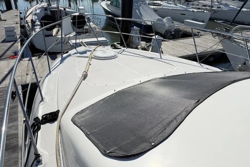 No Worries Yacht Photos Pics 2006 Cruisers Yachts 415 Express Motoryacht docked at marina, top deck view.