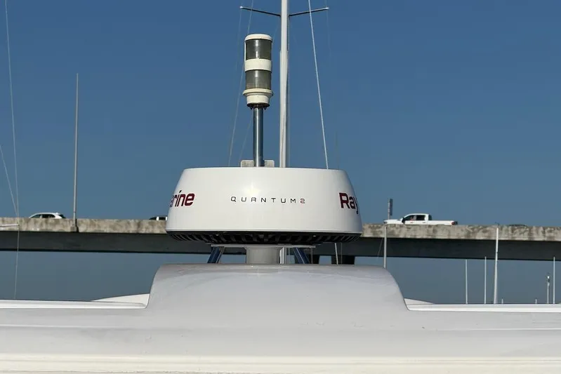 No Worries Yacht Photos Pics Radar system on 2006 Cruisers Yachts 415 Express Motoryacht against clear blue sky.