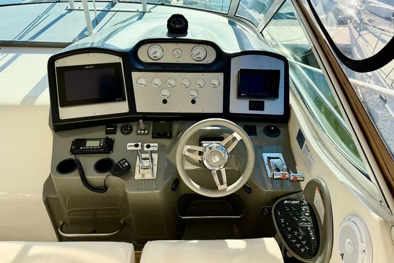 No Worries Yacht Photos Pics 2006 Cruisers Yachts 415 Express Motoryacht helm with modern navigation instruments and controls.