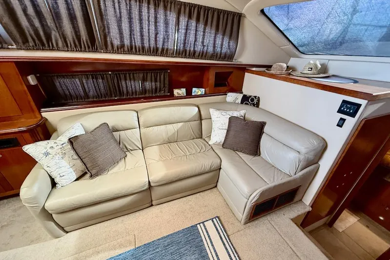No Worries Yacht Photos Pics Luxurious interior of 2006 Cruisers Yachts 415 Express Motoryacht with plush seating and elegant decor.