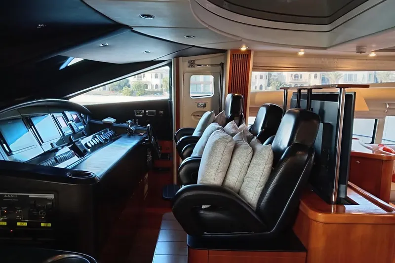  Yacht Photos Pics Luxurious interior of 2006 Sunseeker Predator 82 yacht with leather seating and control panel.